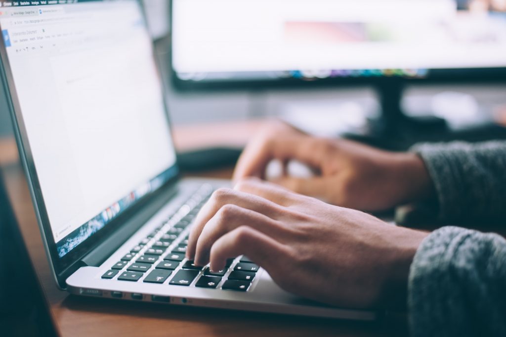 A freelancer working on his laptop